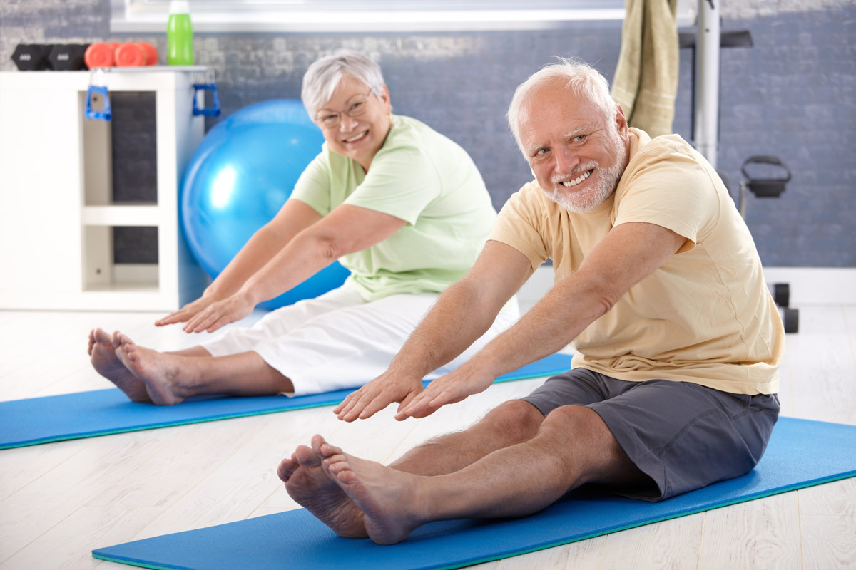 VRS retirement community seniors performing stretches and exercises