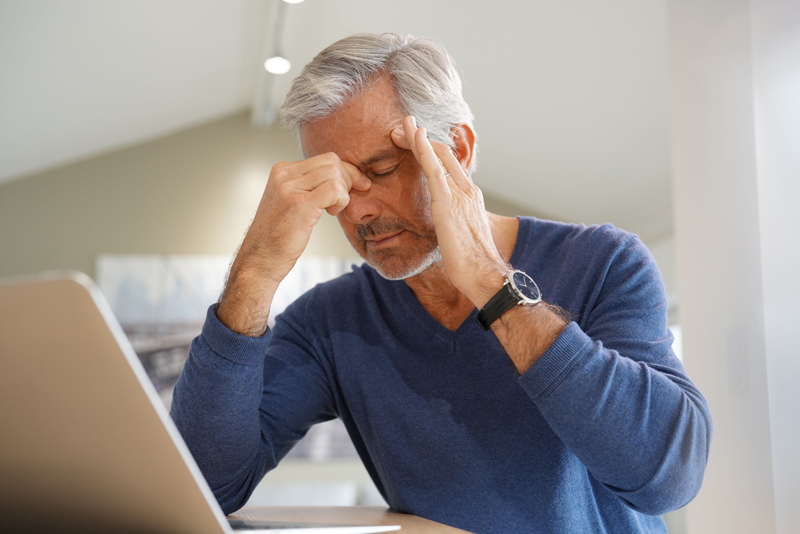 Senior with headache pain at a VRS independent or assisted living community