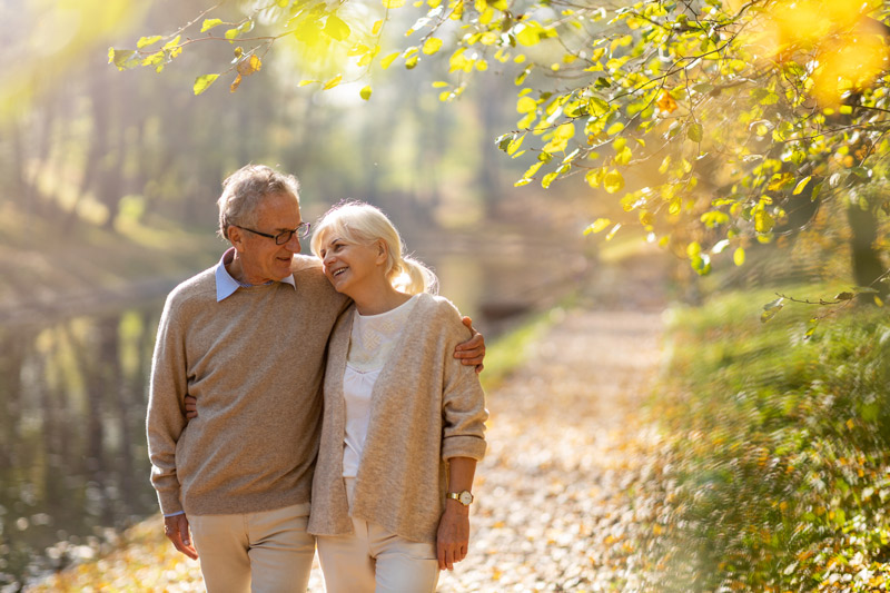 Senior Couple Walking Outside in the Fall at a VRS Retirement Home