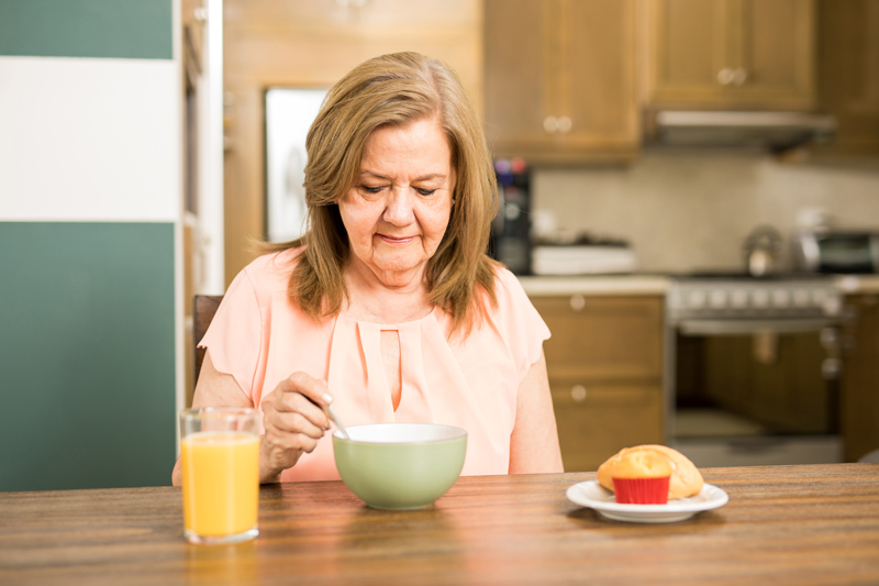 Senior Lady Drinking Soup at a VRS Independent or Assisted Living Community