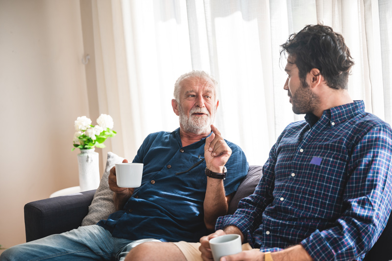 Senior telling story to son at a VRS retirement home